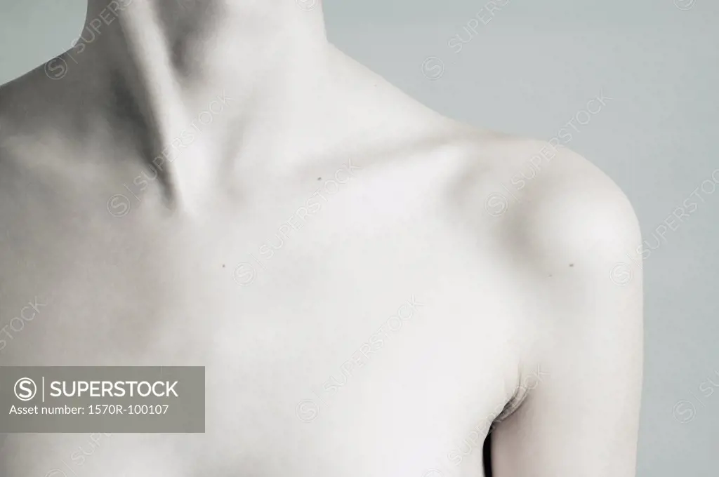 Woman´s lower face, neck and bare upper chest - SuperStock