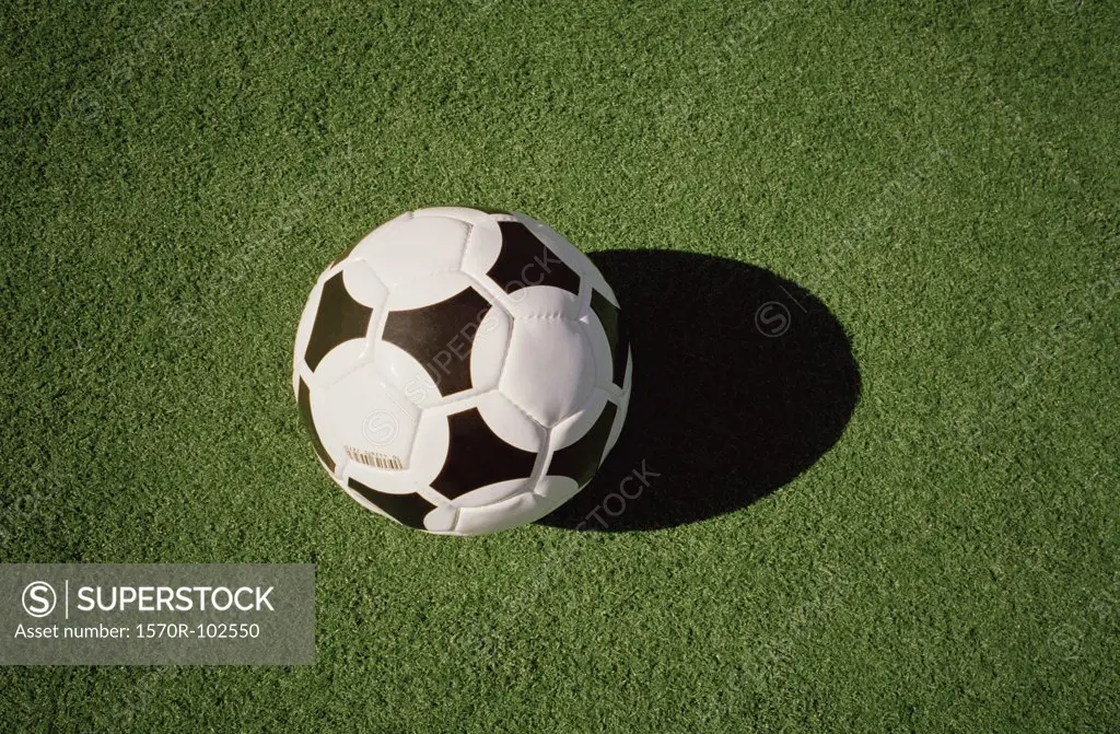 Close-up of soccer ball on playing field