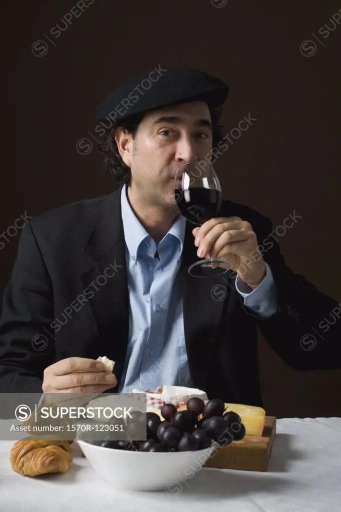 Stereotypical French man with stereotypical French food