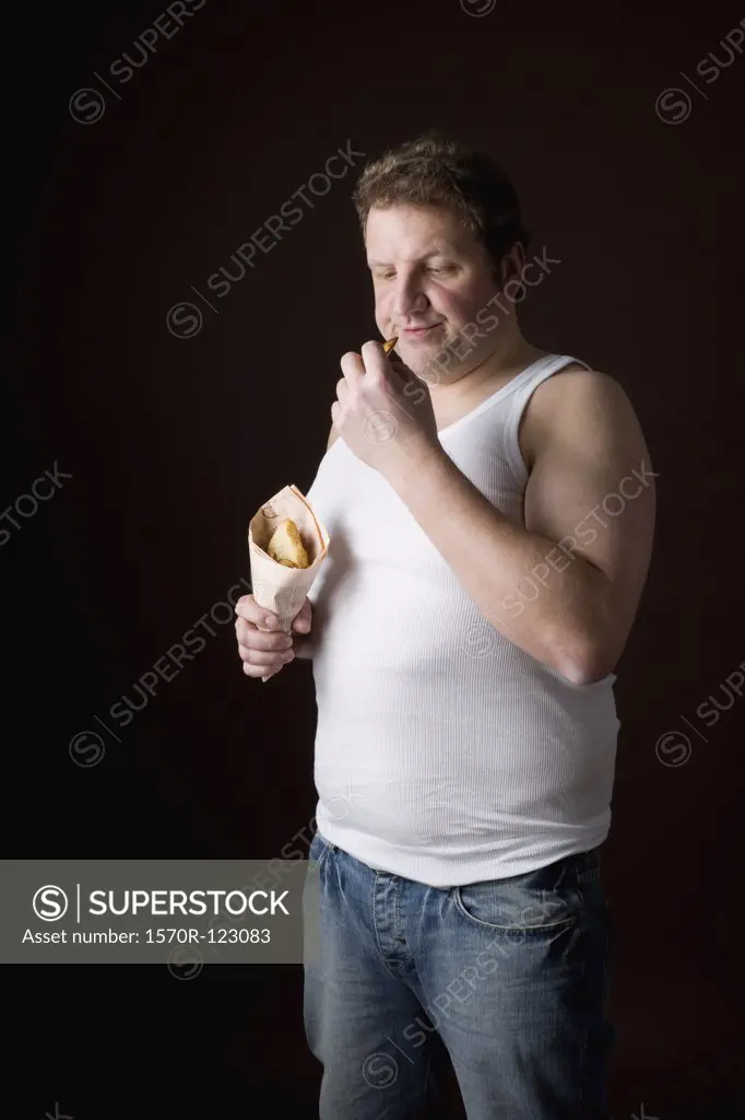 Stereotypical Englishman frowing at a chip