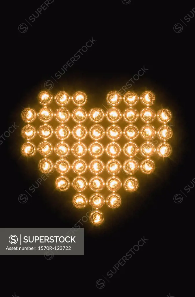 Heart symbol made with illuminated light bulbs