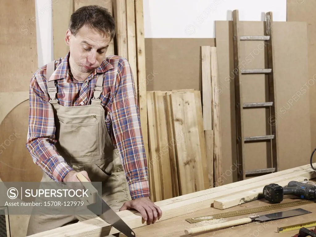 A man sawing wood