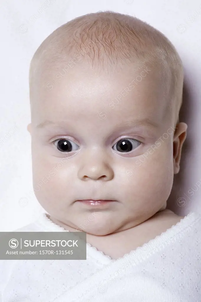 A baby looking surprised, portrait