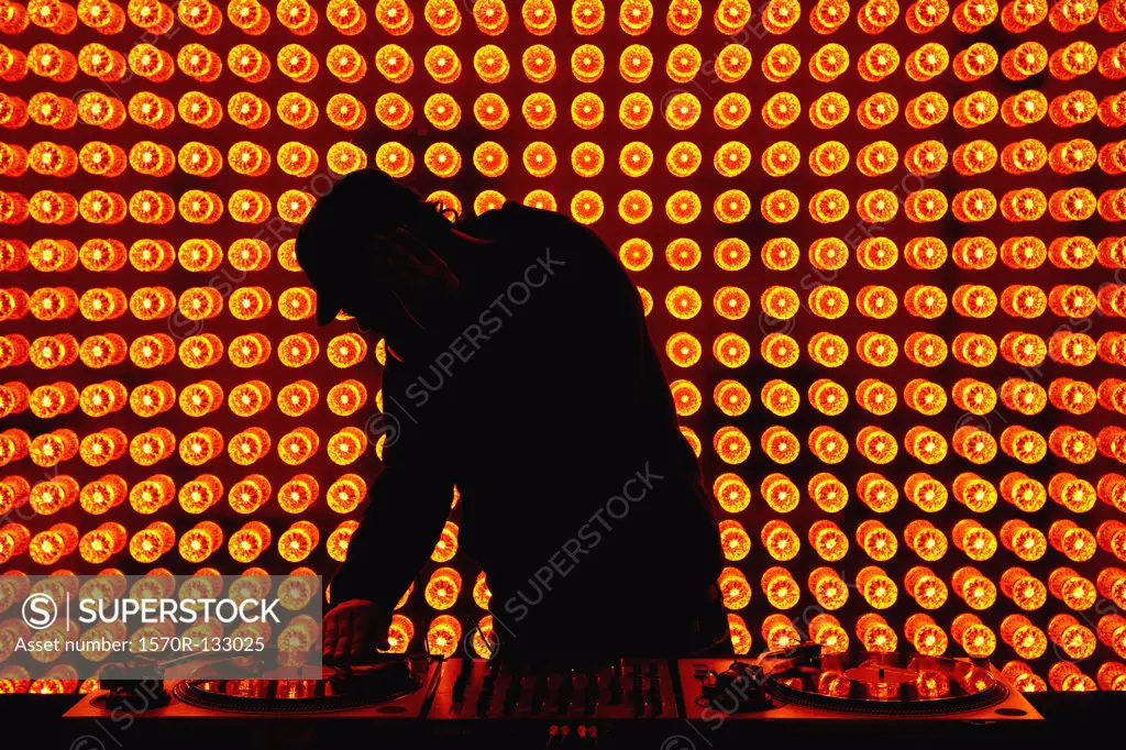 A DJ playing records at nightclub