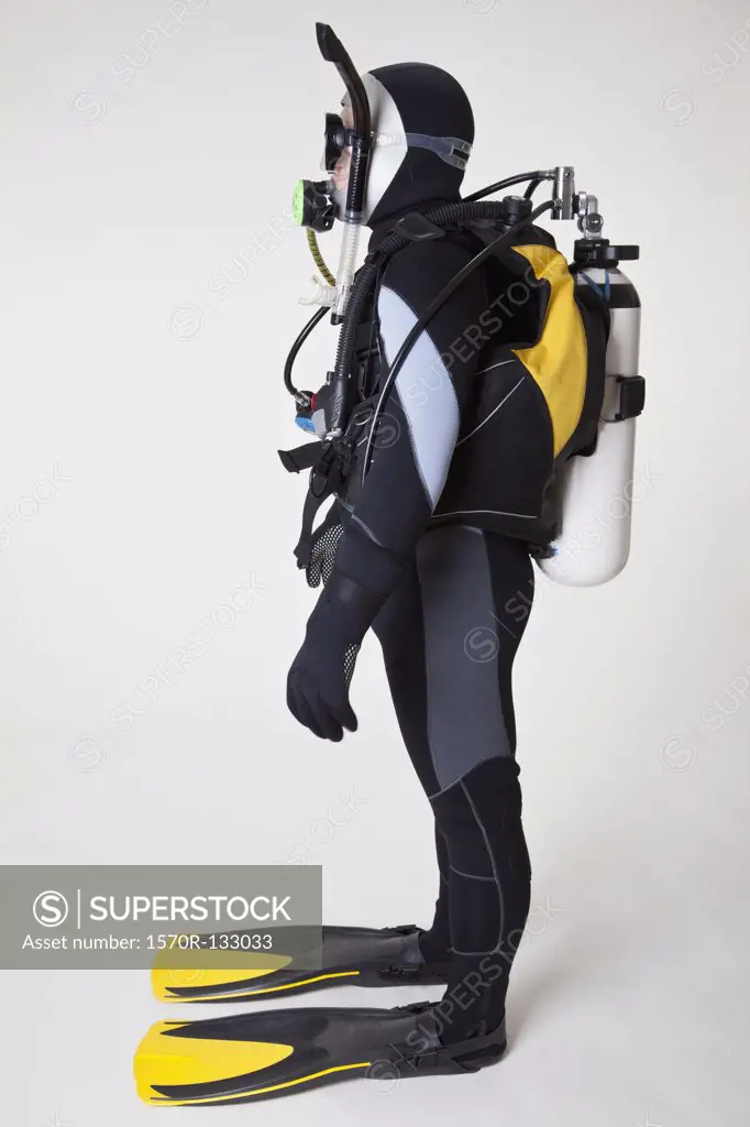 Portrait of scuba diver, side view, studio shot