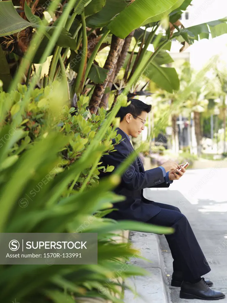 A businessman using a smart phone