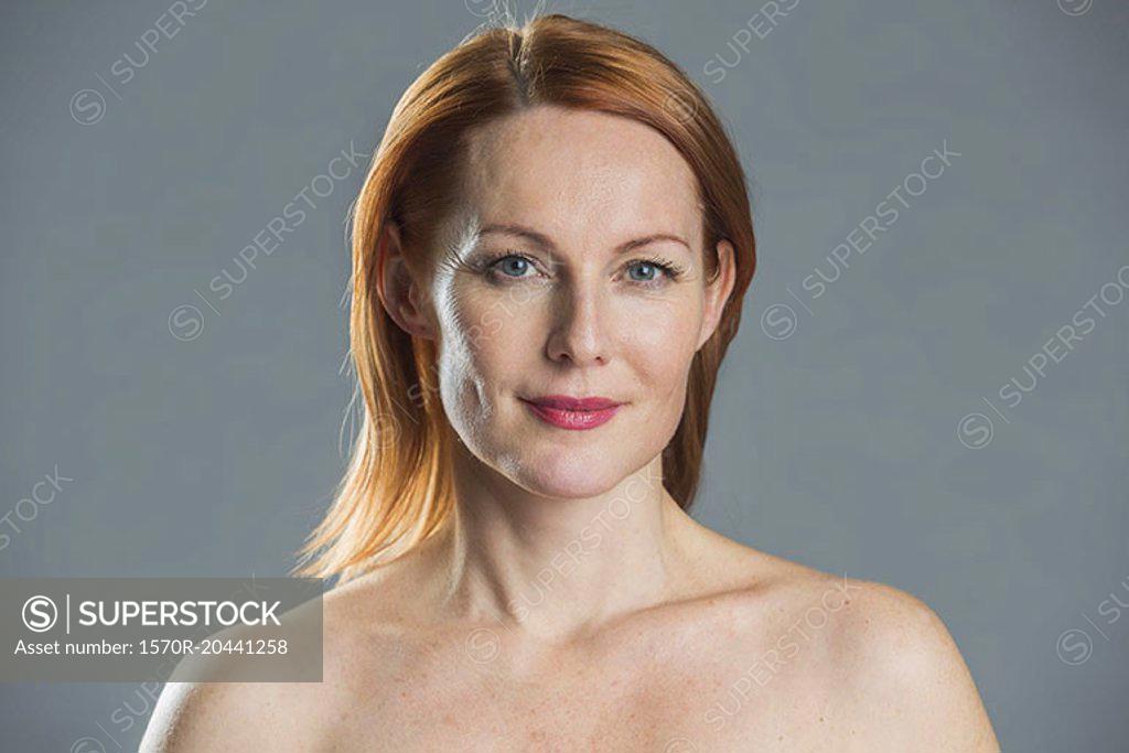 Portrait Of Topless Woman Against Gray Background Superstock