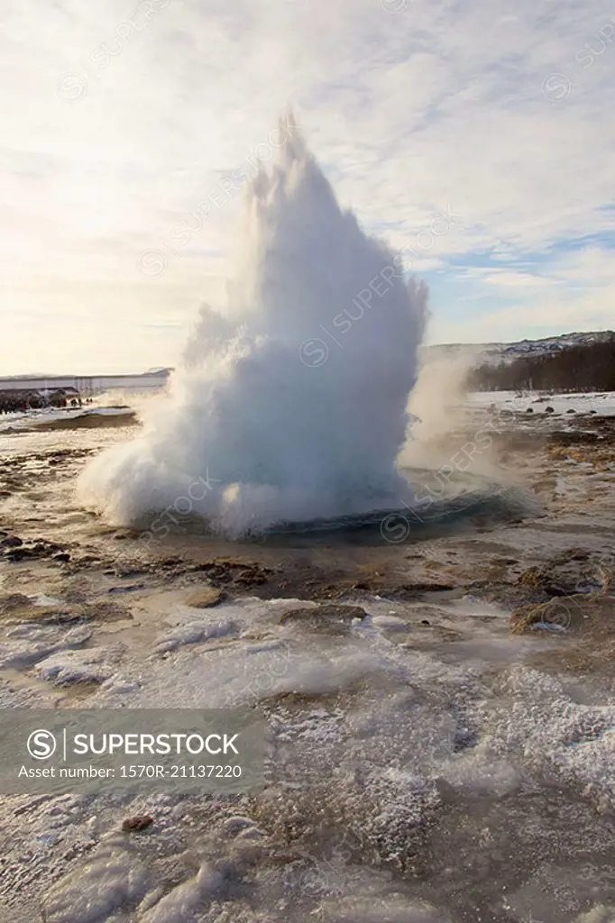 Scenic view of geyser against sky