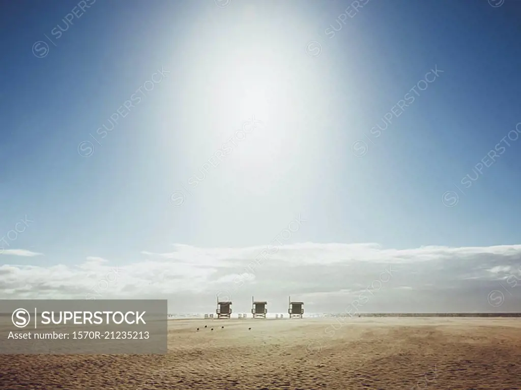 Lifeguard huts at beach against sky on sunny day, Venice Beach, Los Angeles, California, USA