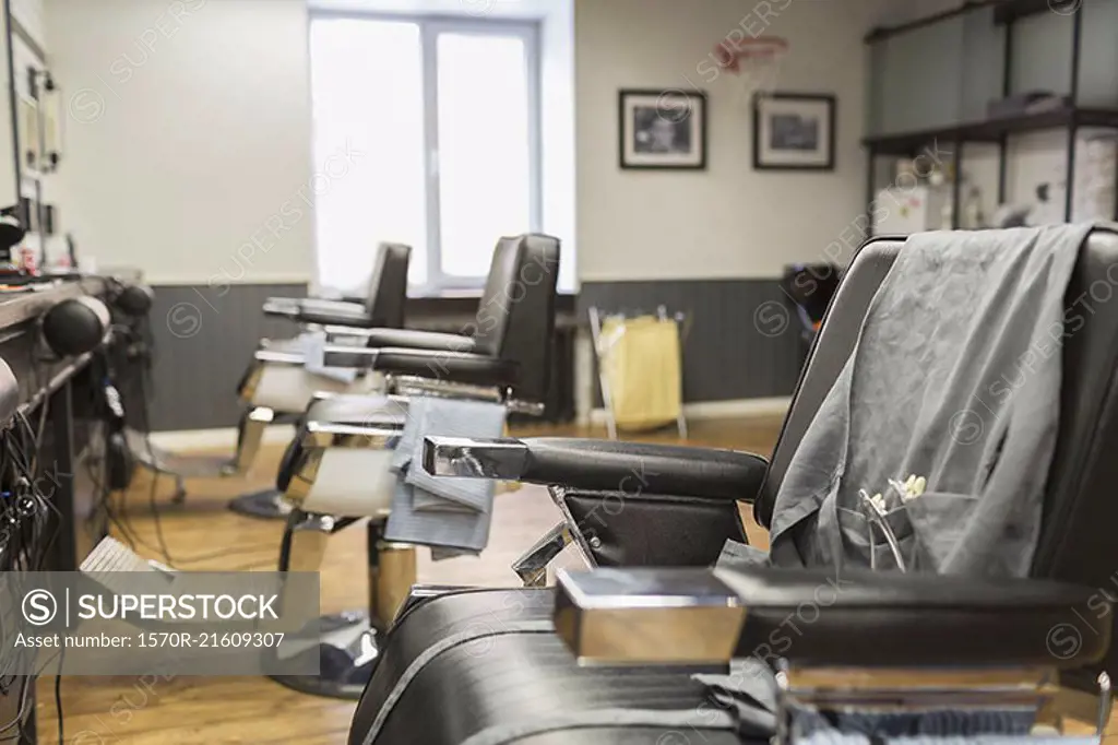 Row of empty chairs at barber shop