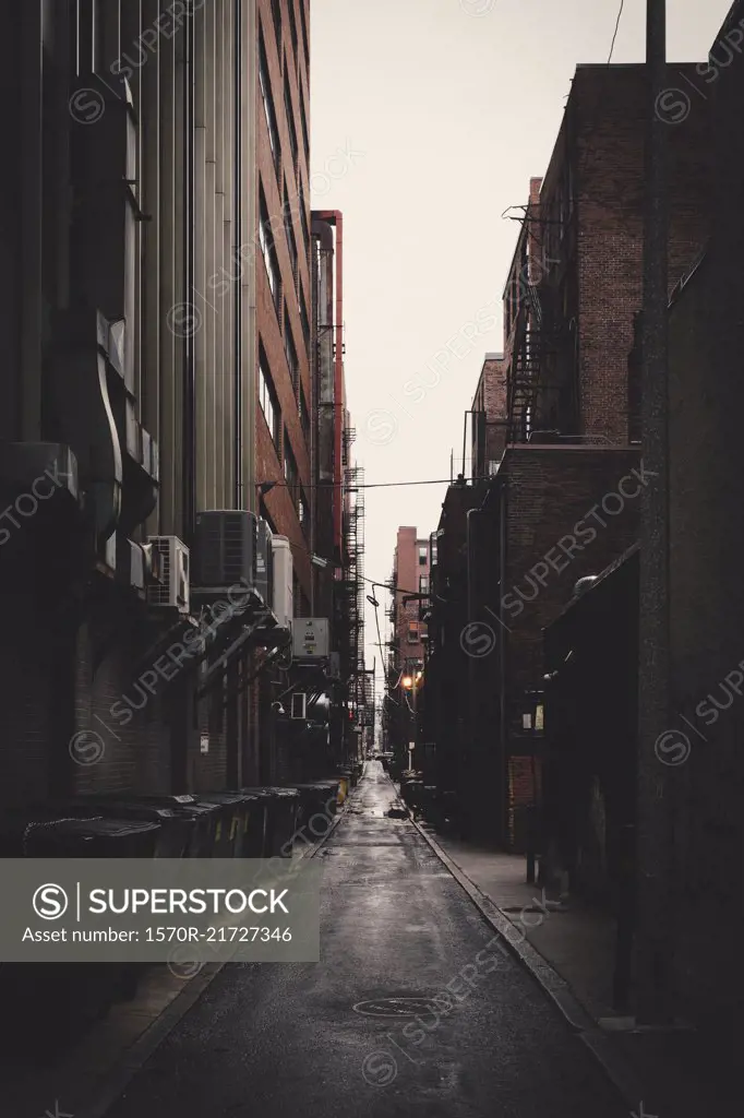 Long alley amidst buildings in city, New York City, New York, USA