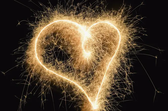 A heart shape drawn with a sparkler