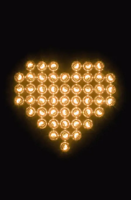 Heart symbol made with illuminated light bulbs