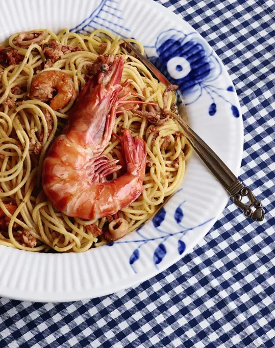 High angle view of prawns in noodles served on plate