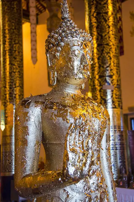 Foil on Buddha statue in temple
