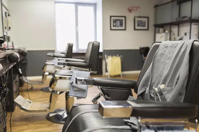 Row of empty chairs at barber shop