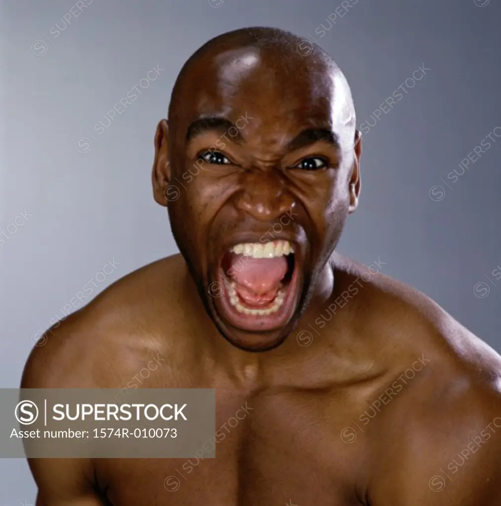 Portrait of a young man screaming