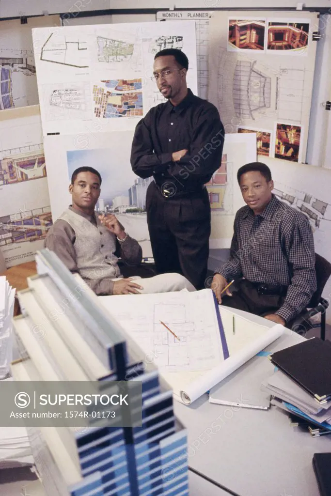 Three businessmen together in an office