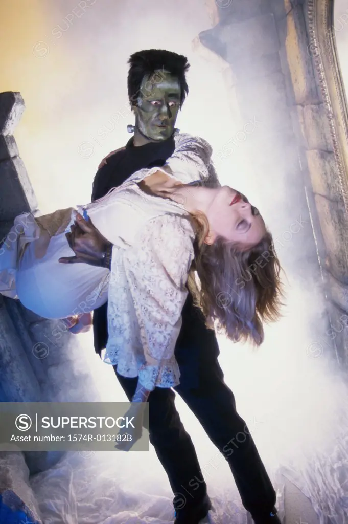 Frankenstein carrying a young woman
