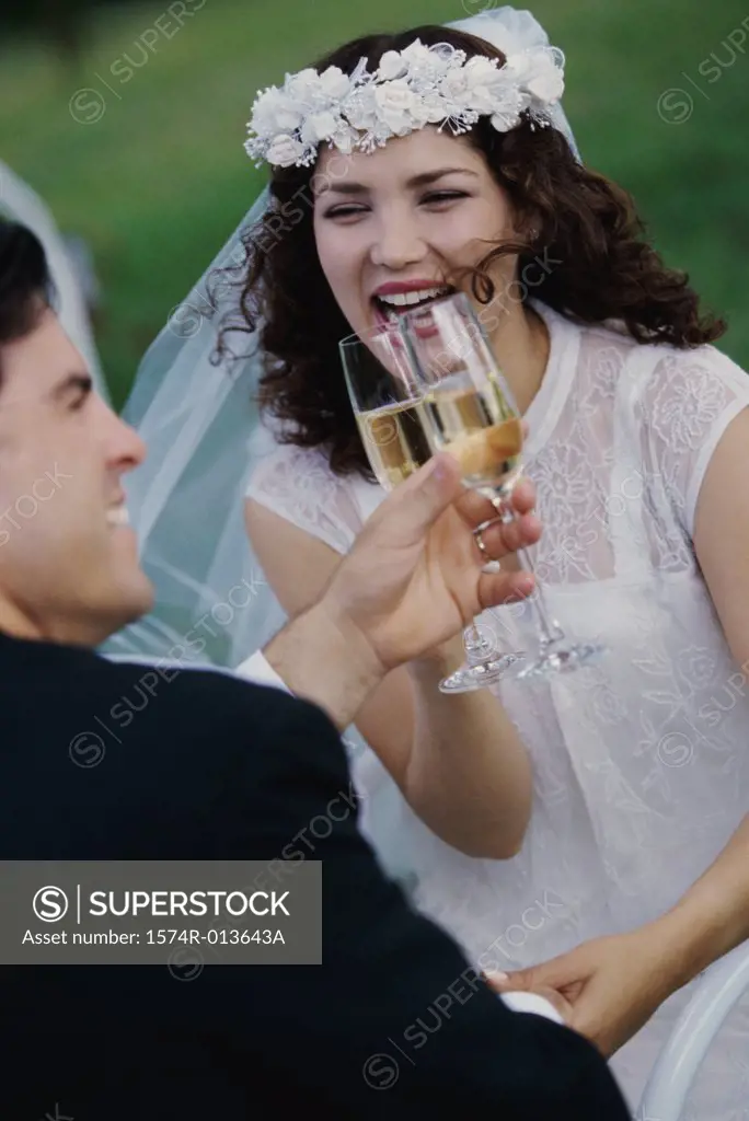 Newlywed couple toasting with champagne