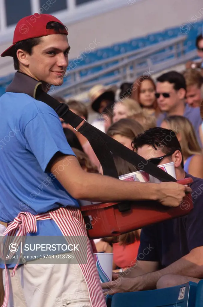 Side profile of a vendor selling drinks in a stadium