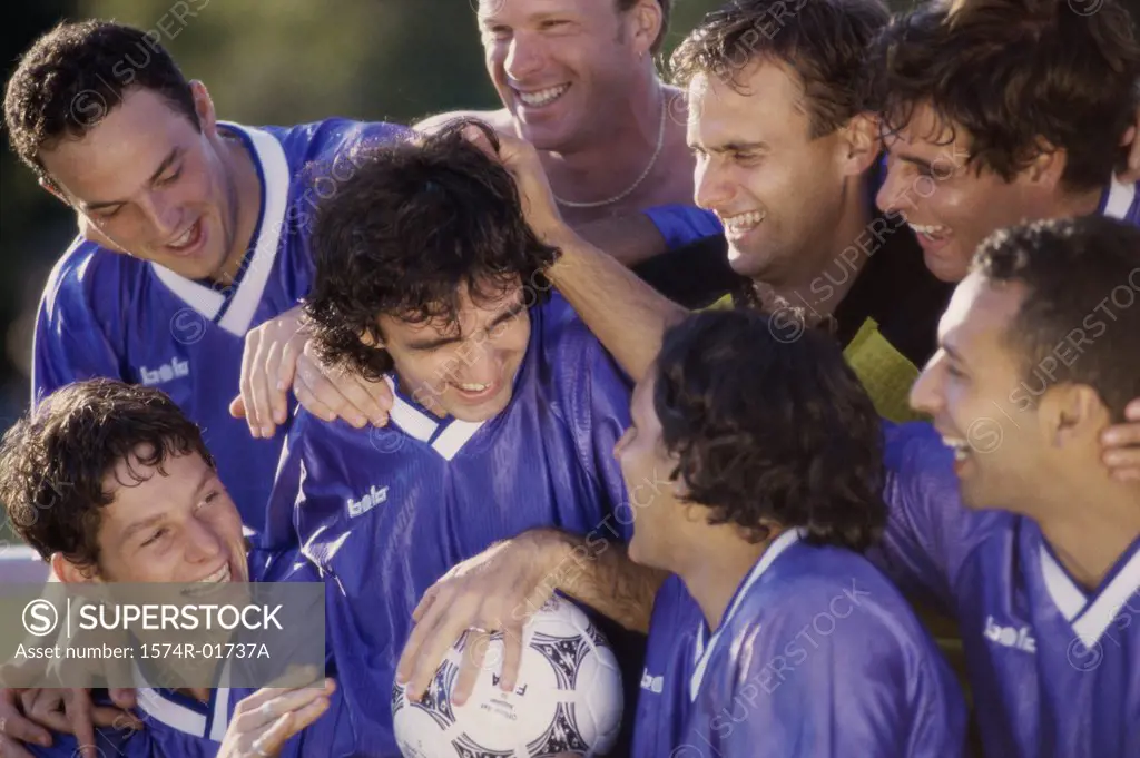 Soccer team laughing together