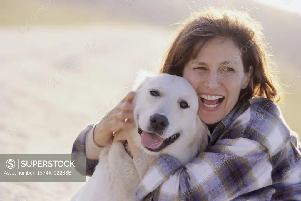 Mid adult woman holding her dog