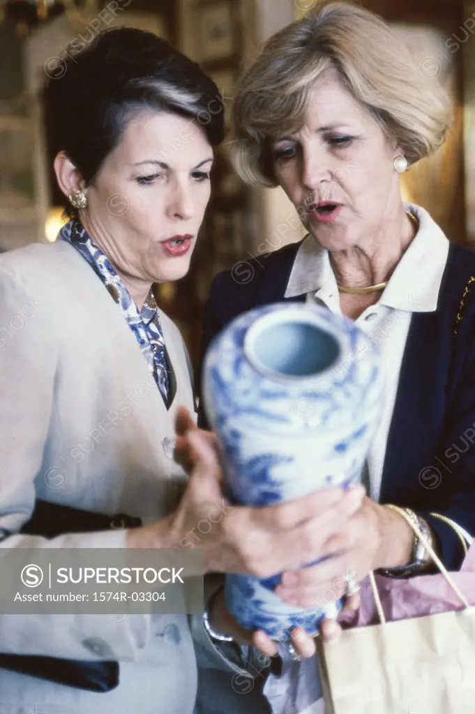 Two mature women shopping in a store