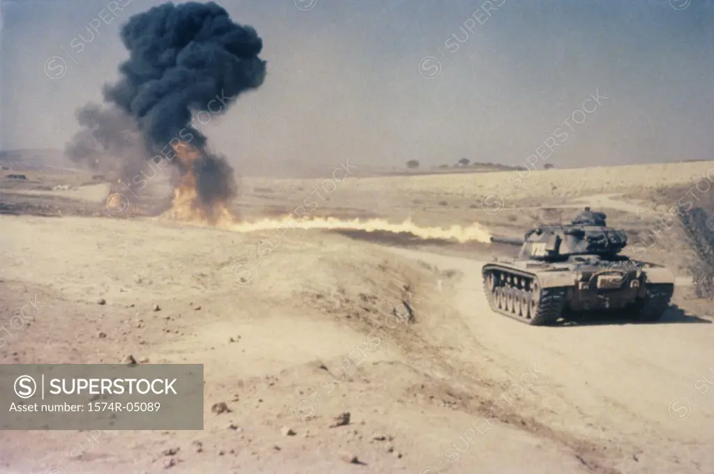 Military tank shooting at a target