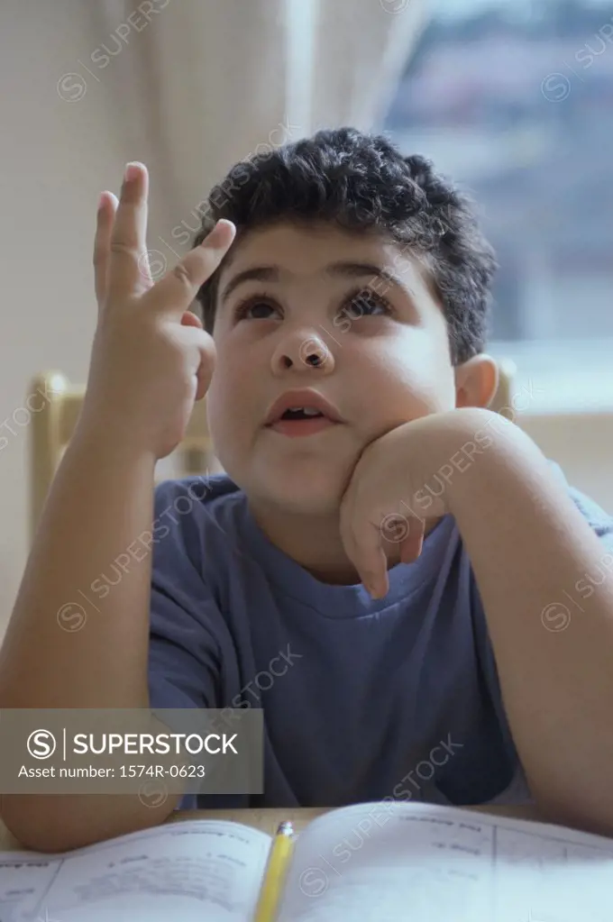Boy counting on his fingers