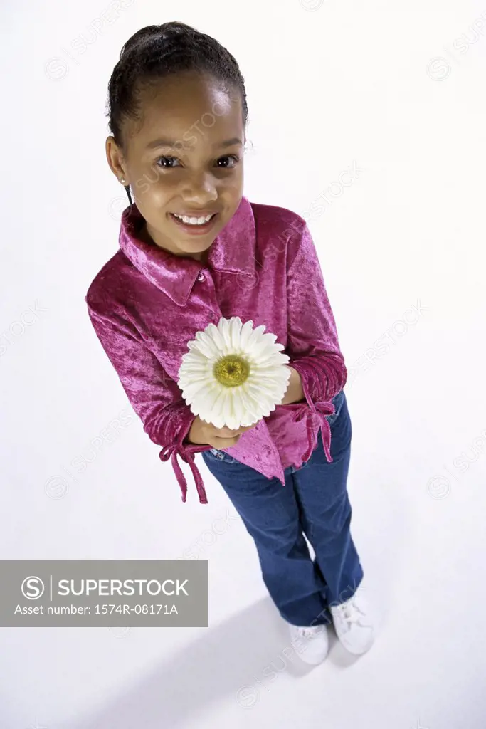 Portrait of a girl holding a flower