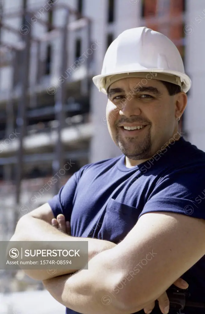 Portrait of a foreman standing at a construction site smiling