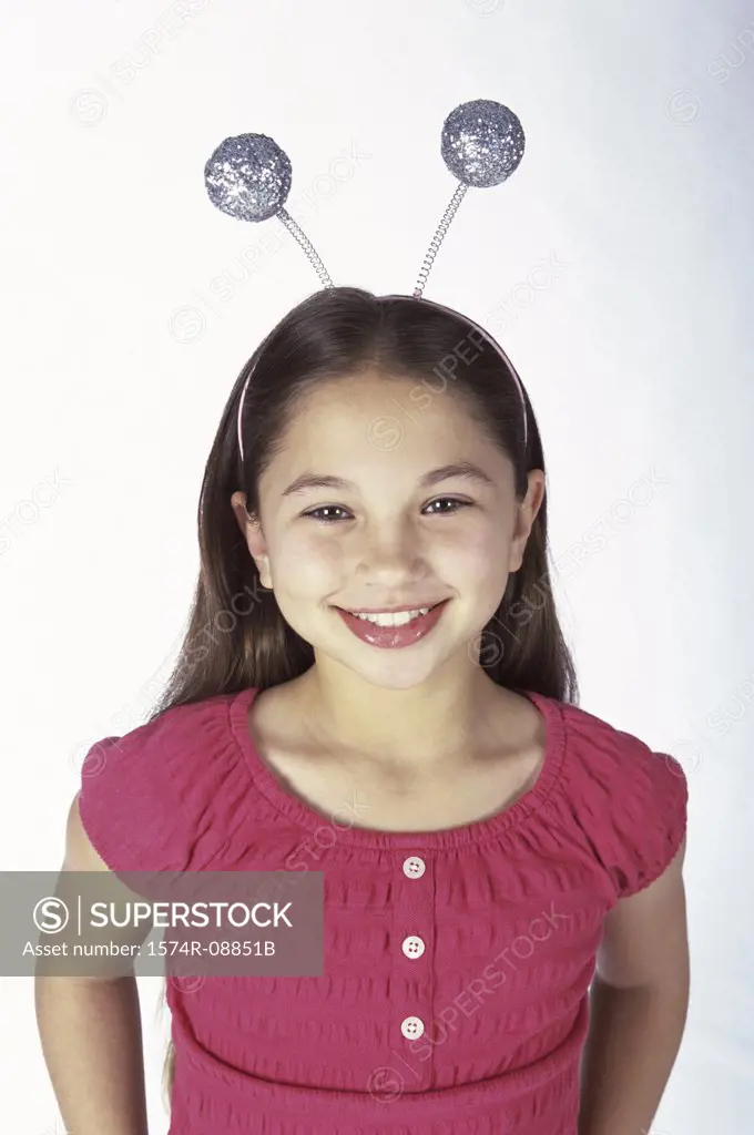 Portrait of a girl wearing antennas on her head