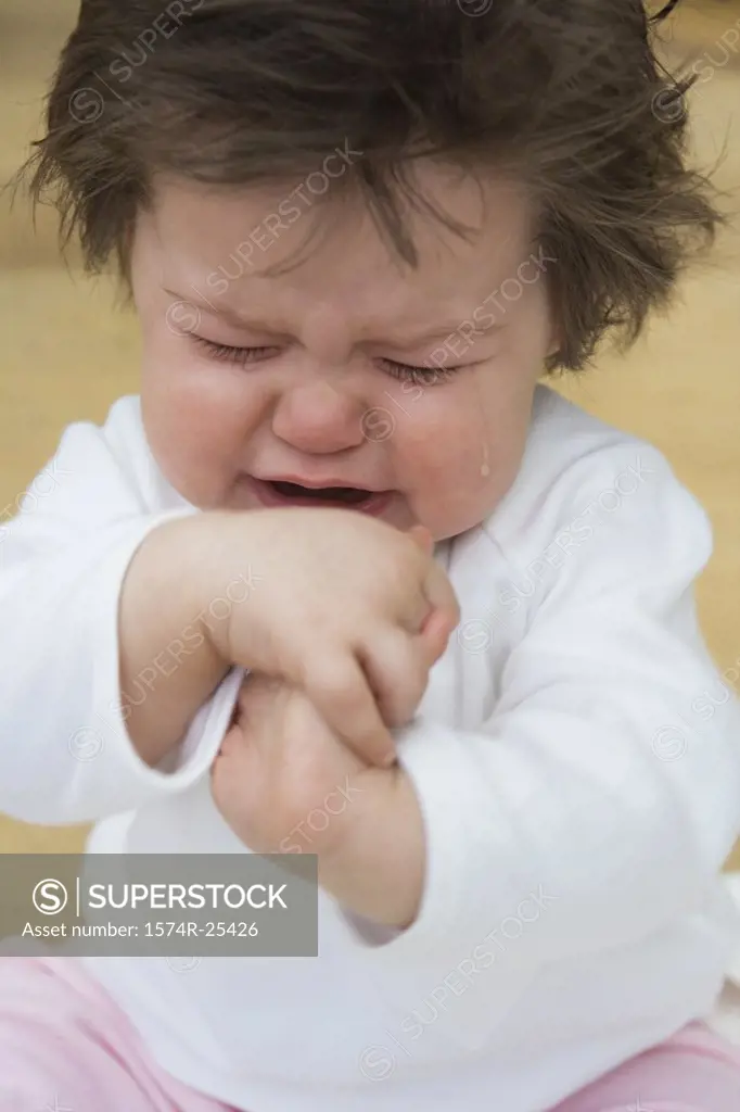 Close-up of a baby girl crying