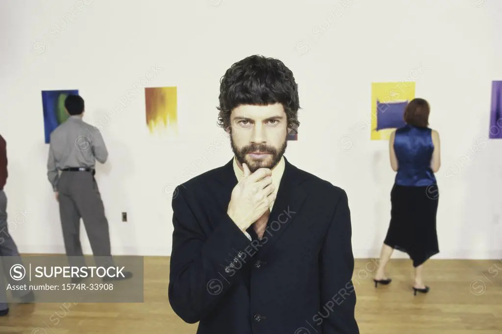 Portrait of a young man standing in a museum