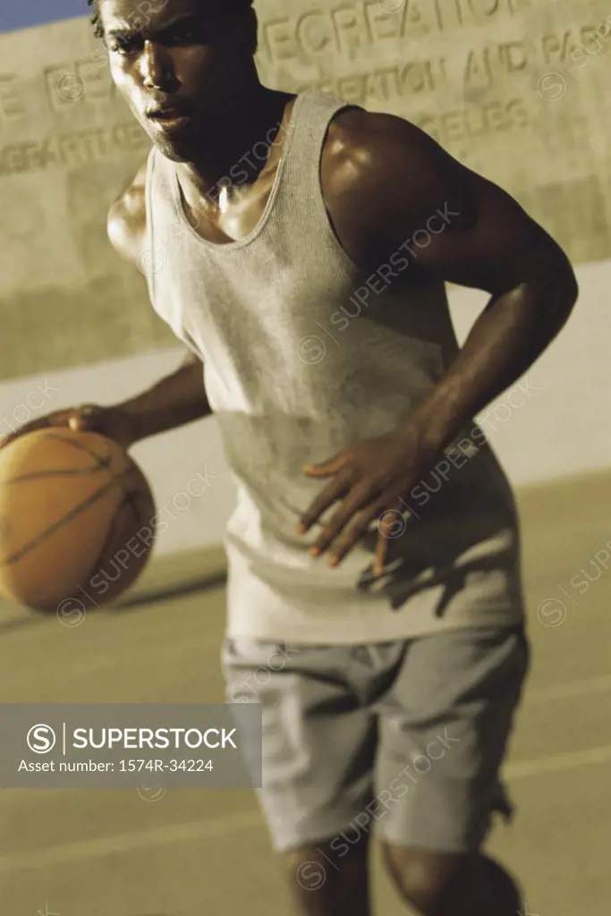 Young man dribbling a basketball