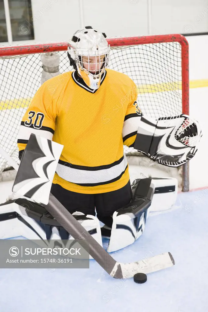 Ice hockey goalkeeper guarding goal