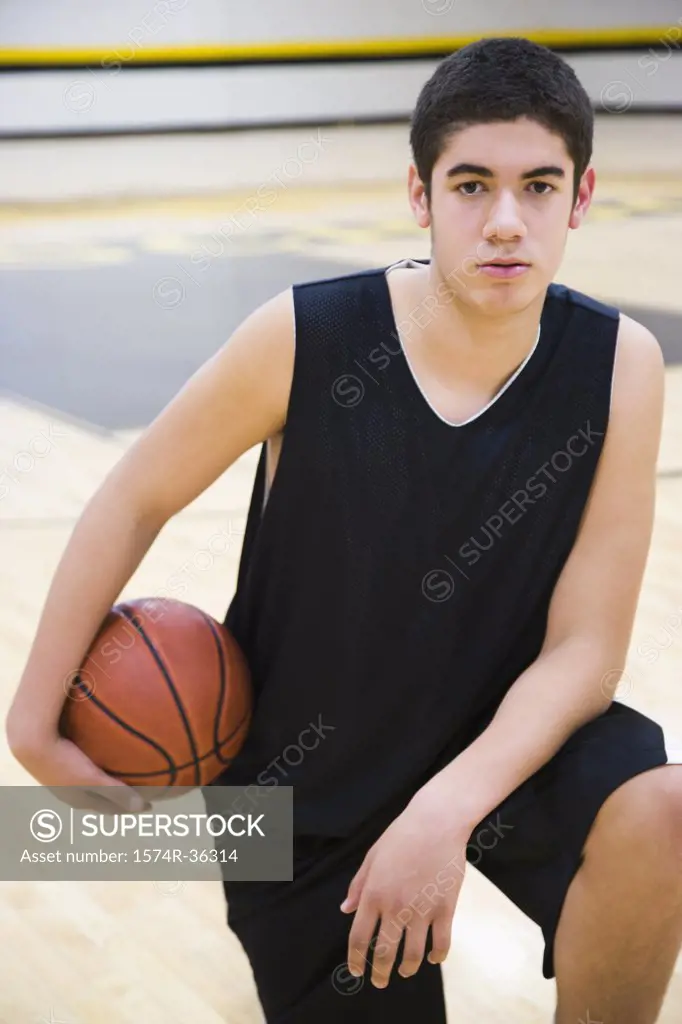 Teenage boy holding a basketball