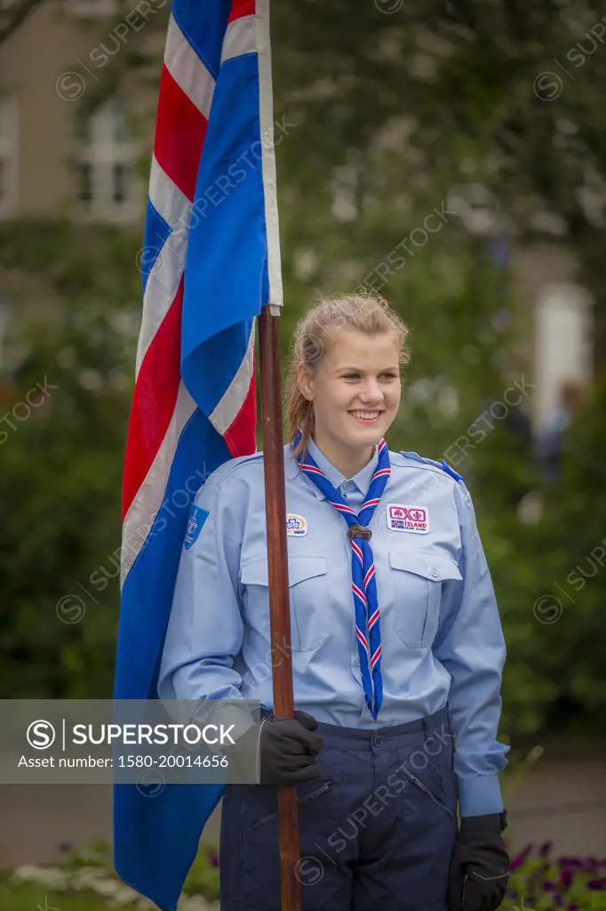 Girl Scout holding Icelandic flag during celebrations for Independence Day- June 17th, Reykjavik, Iceland