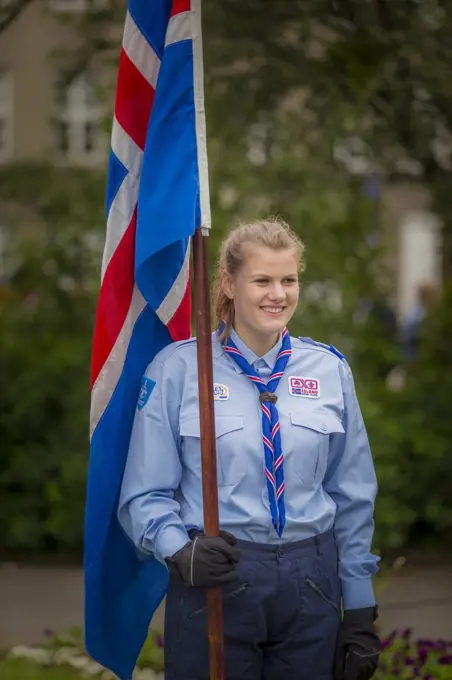 Girl Scout holding Icelandic flag during celebrations for Independence Day- June 17th, Reykjavik, Iceland