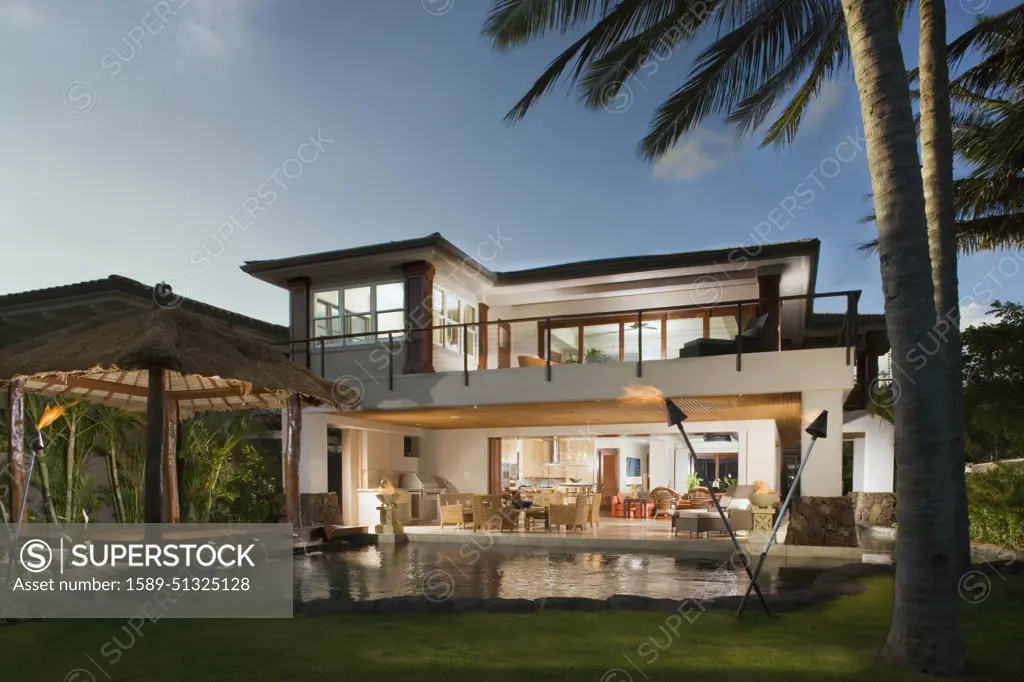 Modern Hawaiian home with pocket doors and wrap around balcony