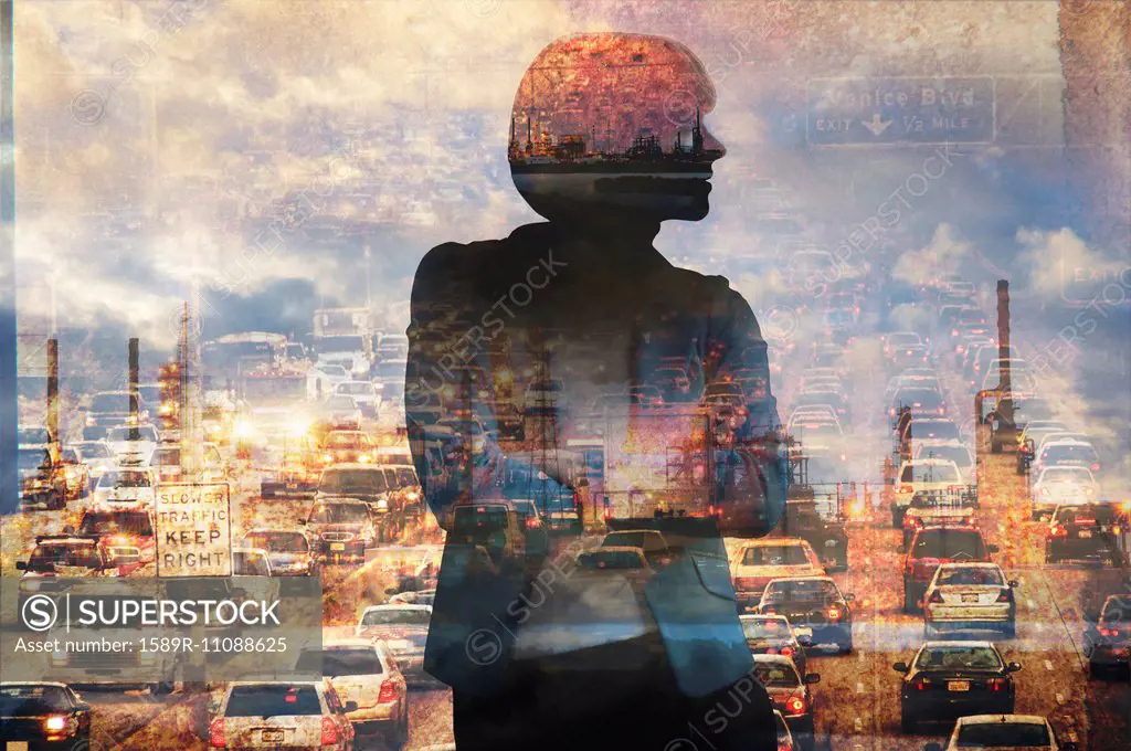 Double exposure of businesswoman and traffic