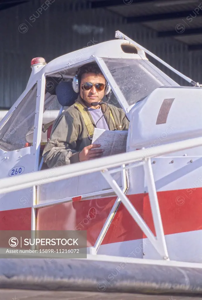 Pilot Sitting in a Cockpit of a Private Plane