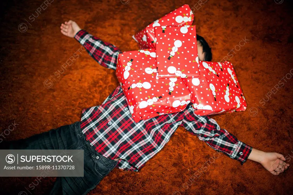 Mixed race boy buried in Christmas gifts