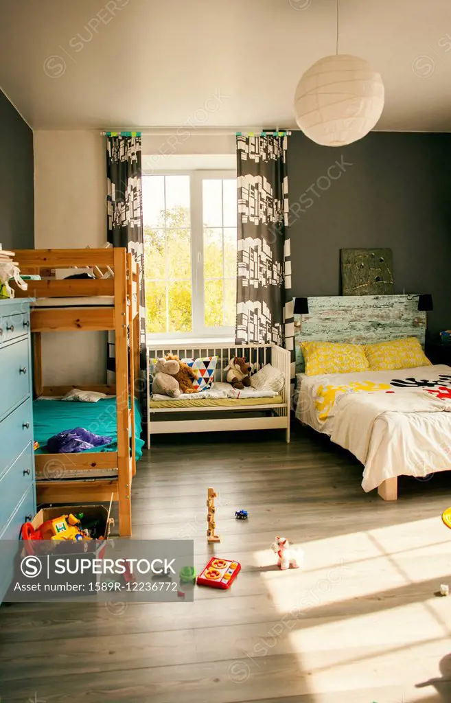 Bunk beds and crib in bedroom of child SuperStock