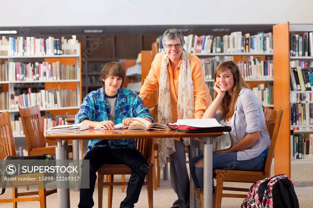 Librarian with students in library