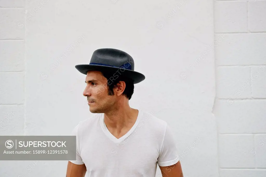 Mixed race man wearing hat outdoors