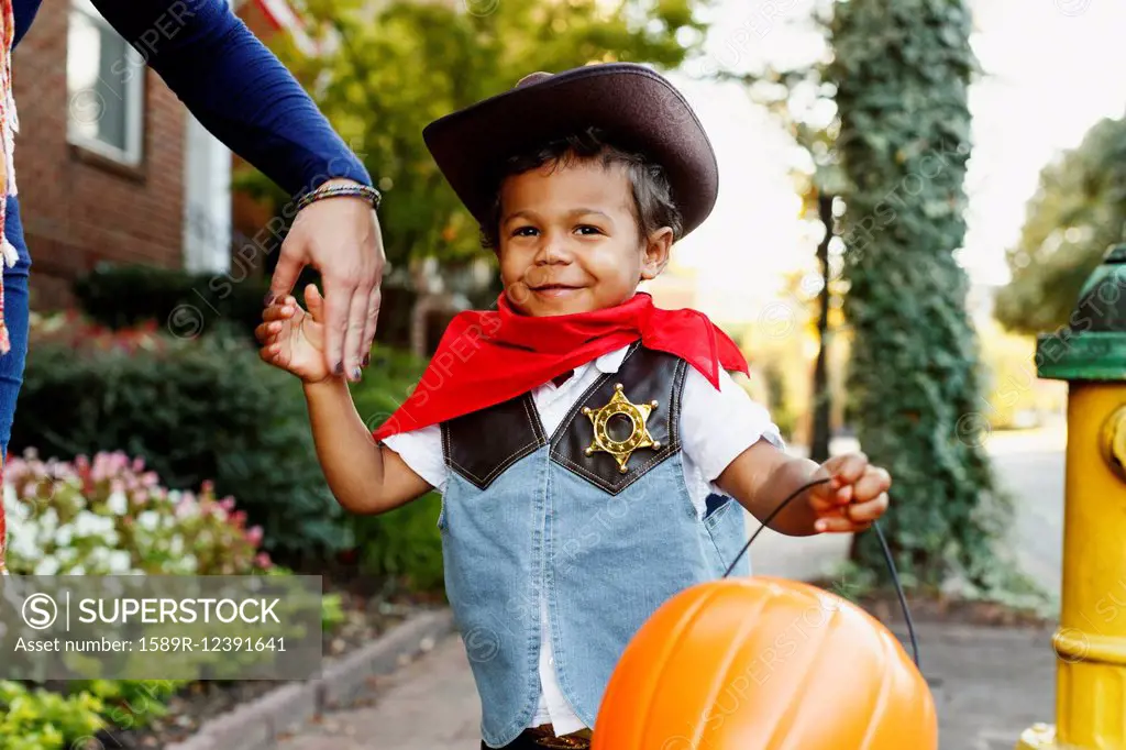 Mother with son dressed as cowboy for Halloween