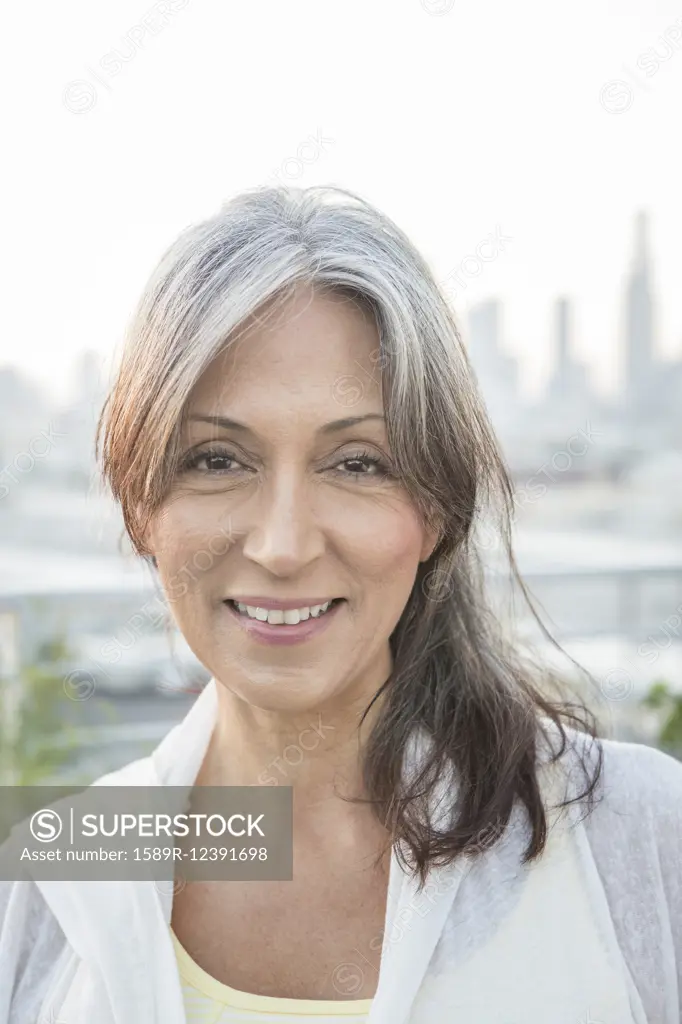 Older mixed race woman smiling