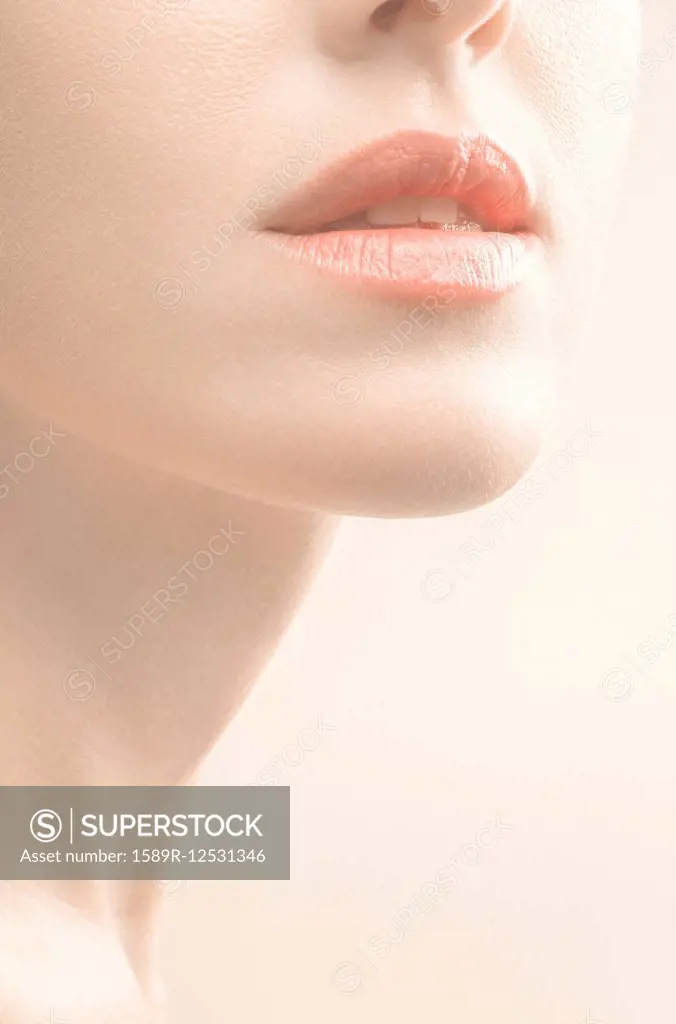Close up of mouth, chin and neck of woman